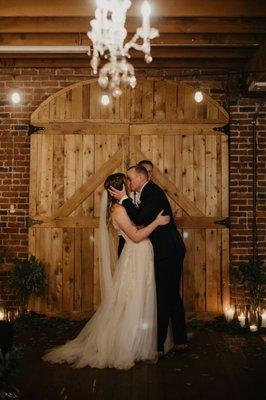 Everything in this picture was included in rental. Chandelier, candles, glass jars, beautiful barn door behind us.