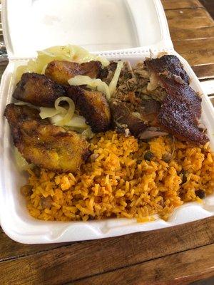 Pork with rice. Comes with plantains and cabbage slaw