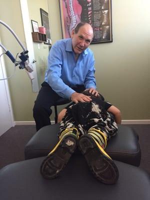 Here's my 2 year old getting his adjustment. Picture taken by my 5 year old, waiting her turn. Dr Gillis is great.