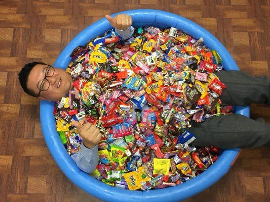 Dr. Lee accepted the challenge of being buried in candy.