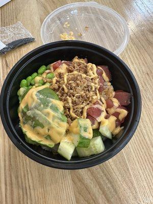 Poke bowl with white rice, tuna, crispy onions, edamame, cucumbers and avocado. Ponzu and spicy mayo sauces. Amazing!