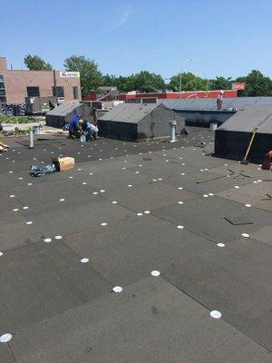 crew installing new roof