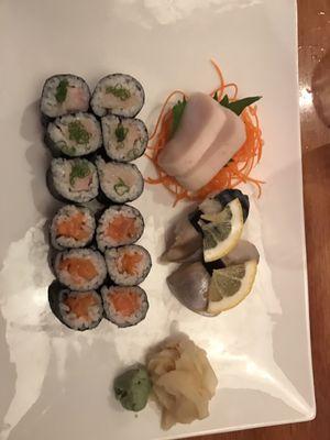 White tuna sashimi, mackerel sushi, yellowtail scallion roll, and salmon roll.