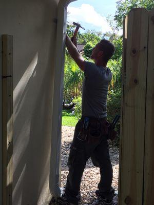 Dennis attaching the downspout.