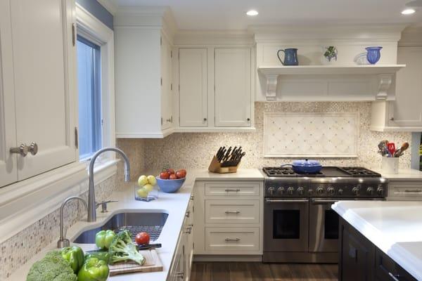 Dark  stained cherry island, carrara countertops; white Rutt Custom Cabinetry Cabinets;