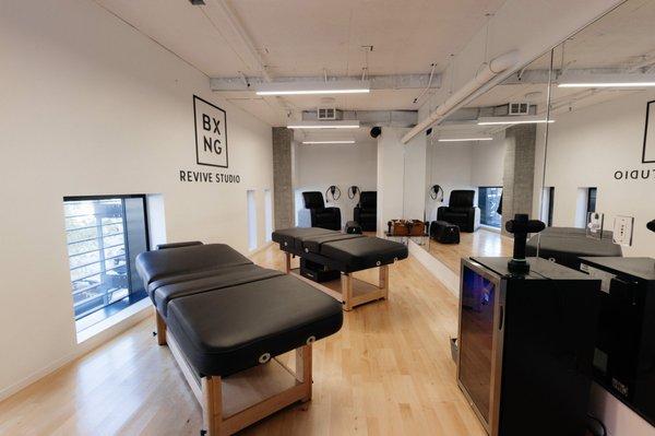 Revive Recovery Studio offering percussion therapy, stretching, Normatec sleeves, and cold towels for best recovery practices.