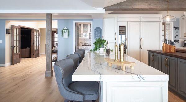 This frameless European style kitchen features contrasting glazed finishes, panelized appliances, and a walnut butcher block countertop.