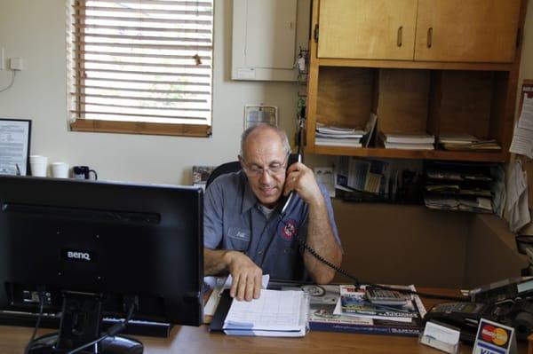 Owner Bill Talus helping customers over the phone.