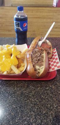 Cheesesteak with pepperoni and an order of cheddar cheese fries. Of course no lunch is complete without a pepsi!