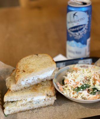 Toasted, Caramelized Onions with Goat Cheese, Sandwich with a side of coleslaw.