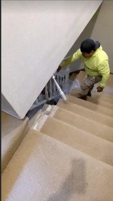 Before - pulling out the old handrail. Notice the weird gap between the wall and stairs!