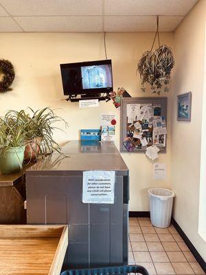 TV, bulletin board near entrance. Also vending machines and seats.