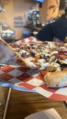 Thin crust! Delicious toppings! Fire baked in that brick oven!