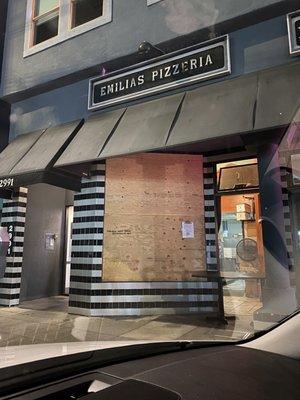 Emilia's Pizzeria -- a true one man show. Don't be fooled by the boarded up window!