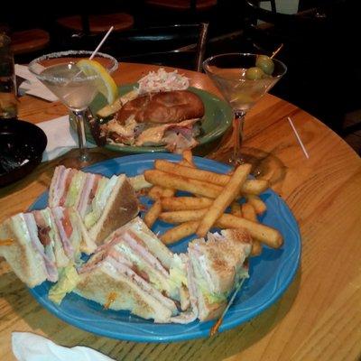 Ham and turkey club, fries, martini. Ham and turkey on potato roll, dijon mustard,  coleslaw, lemon martini.to