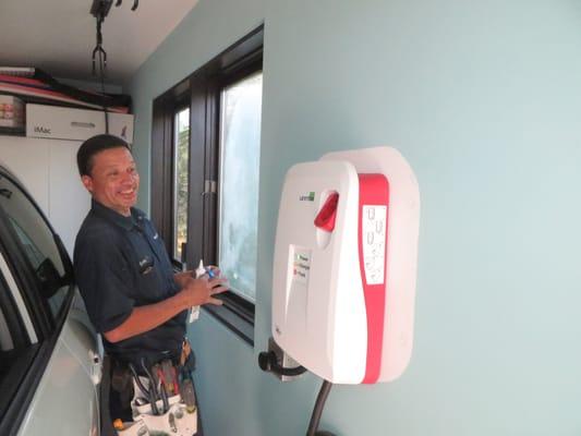 Electrician Rubottom installing an Electric vehicle charging station.