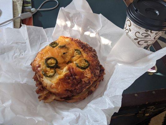 Bacon egg and cheese sandwich on jalapeno cheddar bagel (uncut).