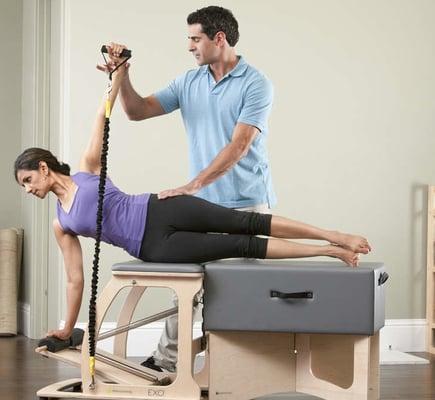 Wahida Sharman and Viktor Uygan on Balanced Body EXO chair.