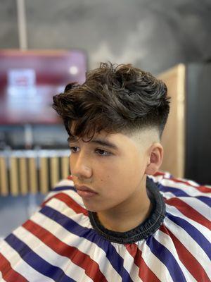 Texturized crop top haircut with a drop fade, and edge up to finalize the look.