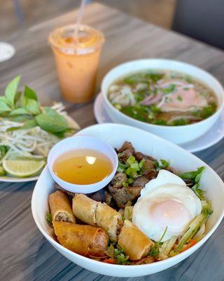 Ig: @eat_with_jeleneeee | CreAsian Special Pho, Vermicelli noodles with Thit Nuong, egg rolls, and an added egg, and a Thai tea