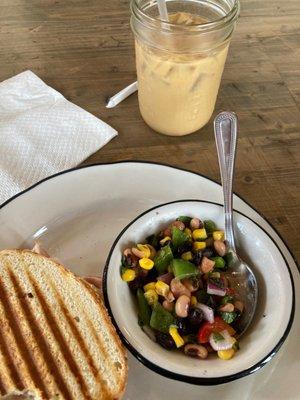 Turkey panini on gf bread, cowboy caviar and a honey Oatmilk coldbrew