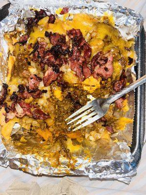 Chili cheese fries with pastrami, grilled onions