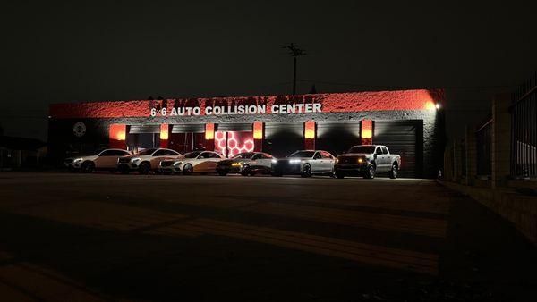 A lineup of vehicles in front of our six roll up gates at night