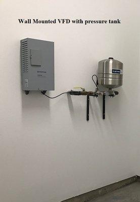 Wall mounted drive with pressure tank