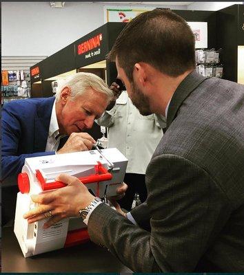 Owner of Bernina International Signing Bernina Sewing Machines at Atlanta Sewing Center.