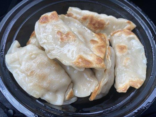 Pan fried dumplings. Filled with chicken.