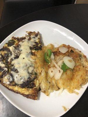 Mushroom and spinach omelette and hash browns