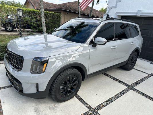 5% all around, 70% on the windshield, 80% on the sunroofs. All ceramic.