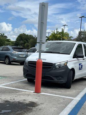 USPS worker parked in the reserved only for curbside pick up spot at Publix. She was inside doing her own shopping.