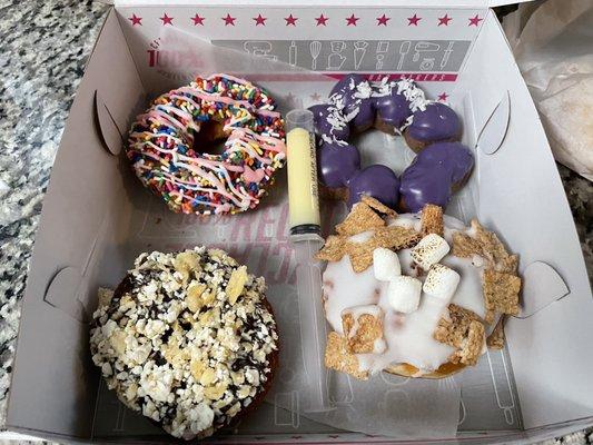 L-R, top-bottom: old fashioned donut w/sprinkles, donut w/ube, cronut w/chips, donut w/cinnamon toast crunch