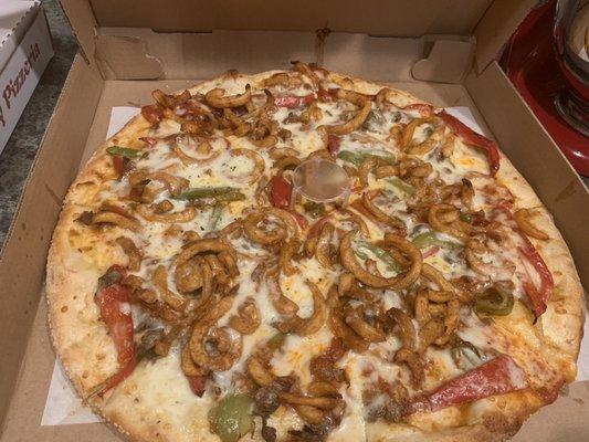 Philly cheesesteak pizza with curly fries.