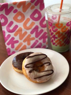 "Donut of the Day" (vanilla drizzled with chocolate) a chocolate frosted donut, and an Iced Matcha Latte.