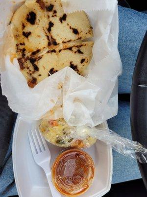 cheese pupusa served with a pickled vegetable side and a sauce