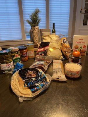 Pickles, pita, halva, falafel mix, dolmas, kopiko candy, pasta, kalmata olives, tahini, eggplant spread, pasta, honey dijon chips