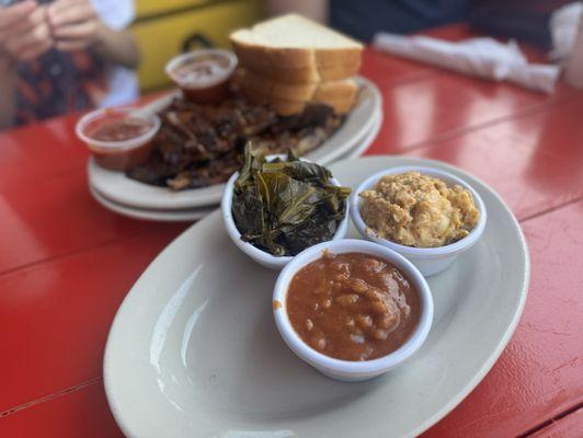 Full rack of ribs with sides of mac n cheese, collard greens, and baked beans