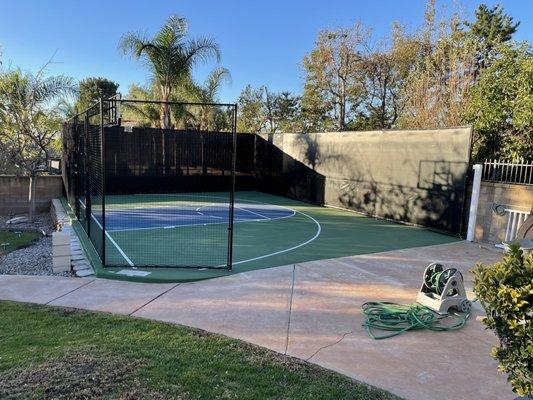 Basketball court, netting, privacy screen and painted court