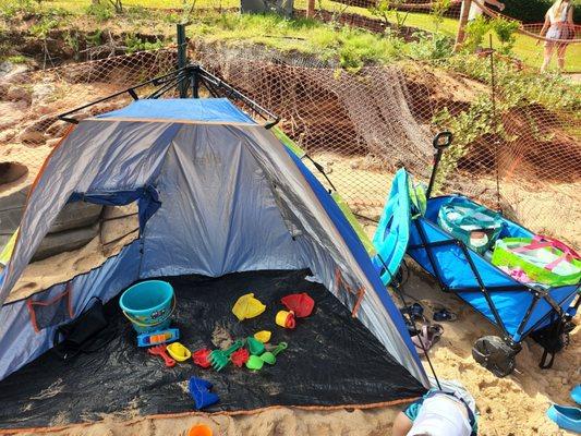 Sun shade, sand toys, and wagon.