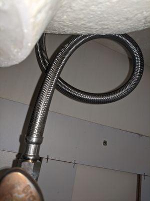 Faucet water supply line installation.