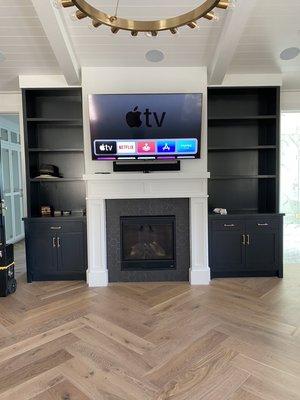 65 inch wall mounted on a tilting bracket with a Sonos sound bar no wires showing!