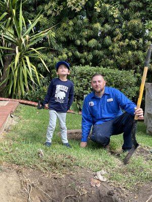 Travis and my son Vincent, working hard to make our plumbing work again.