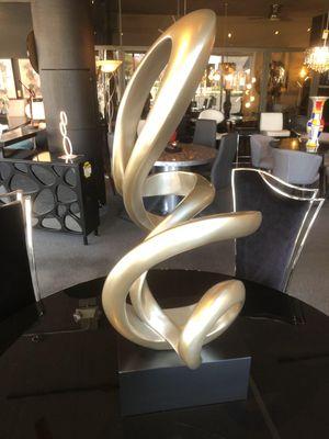 This a silver and black accessory piece offering a huge presence in any room. This is a statement piece, that has a modern aesthetic.