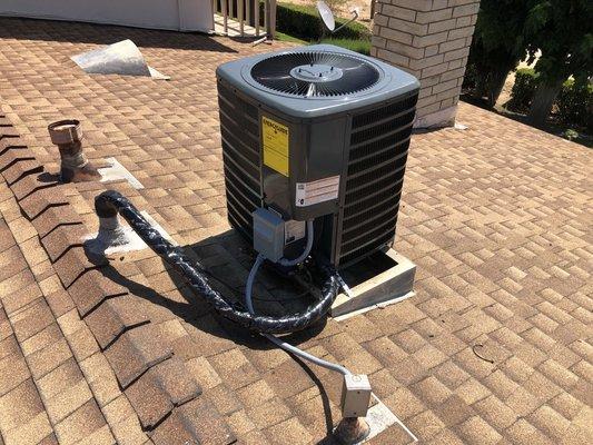 Goodman system installed condenser is on the roof of the condo.