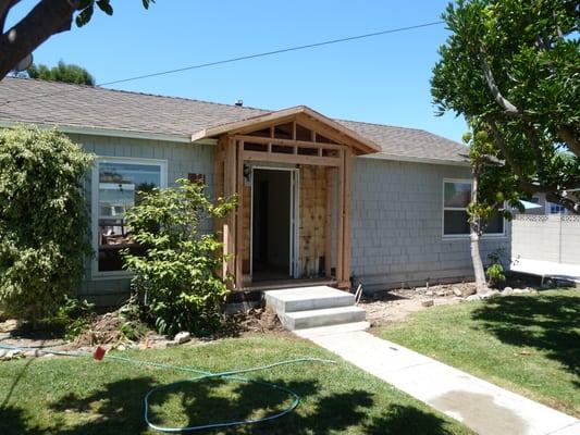 Room addition in Costa Mesa. The new front porch created dimension on the slab front.