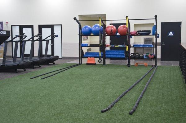 Fitness Floor includes a turf field with function items