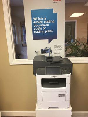 A tabletop Lexmark mfp with copy, scan, and fax