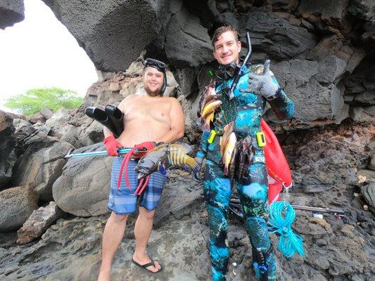 Guide Joey and David cleaning the reef on Lanai